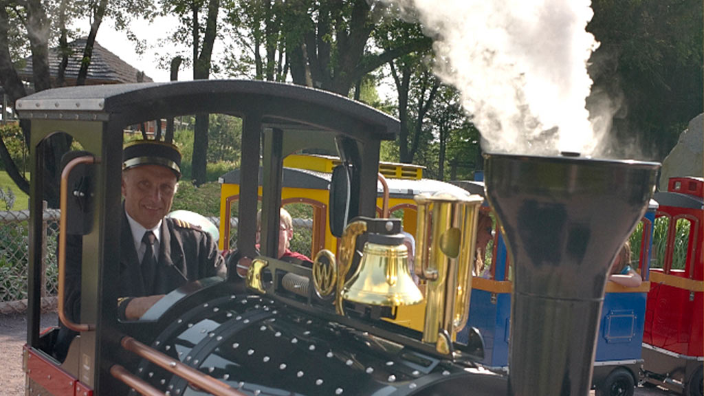 Mini Express trackless train releasing realistic steam from the chimney with integrated Smoke Effect System